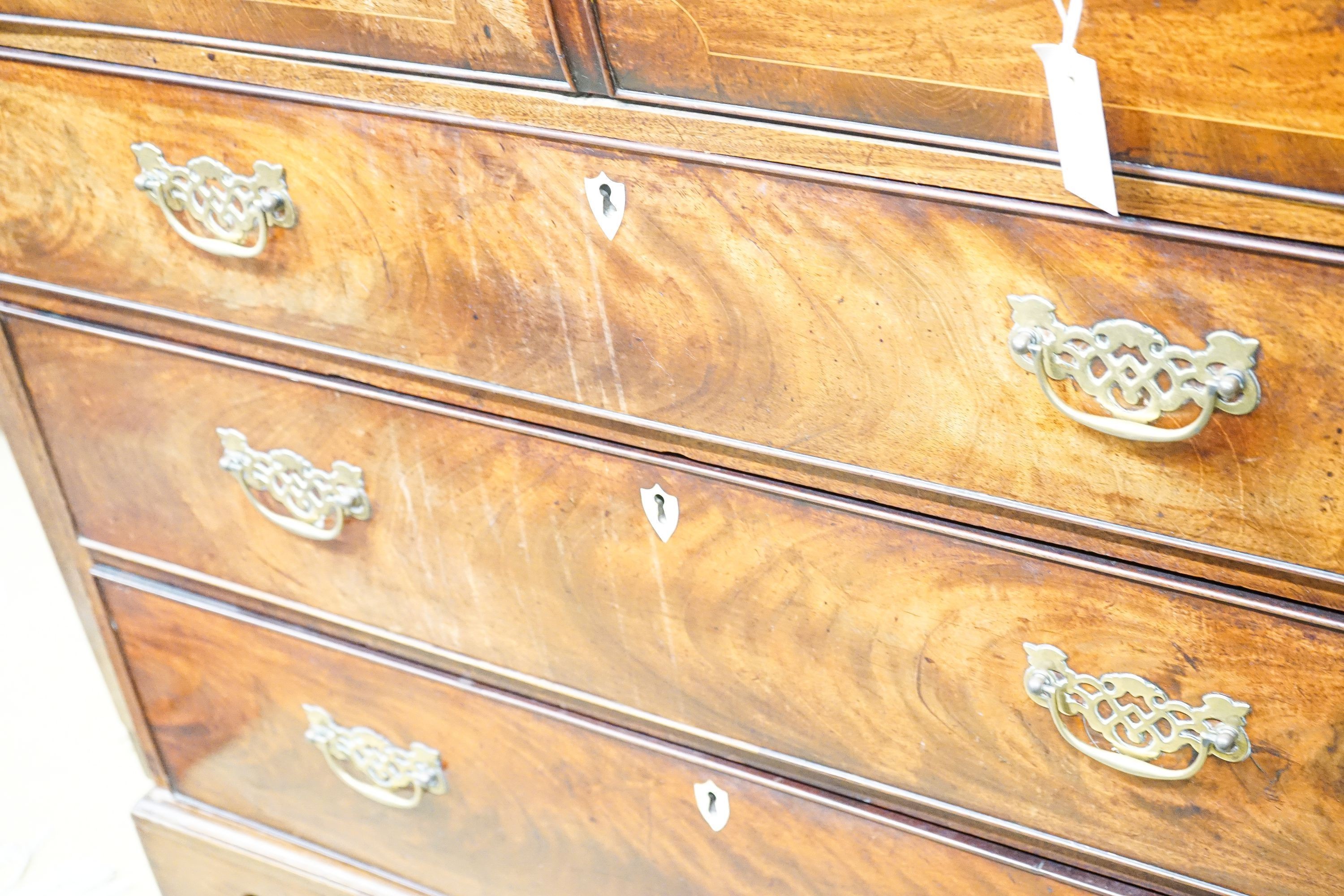 An early 19th century inlaid mahogany secretaire bookcase, length 103cm, depth 53cm, height 221cm